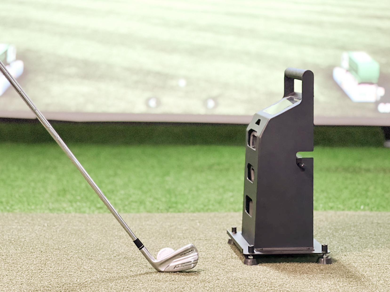 An Optimized Deviation metal launch monitor case in a golf simulator studio